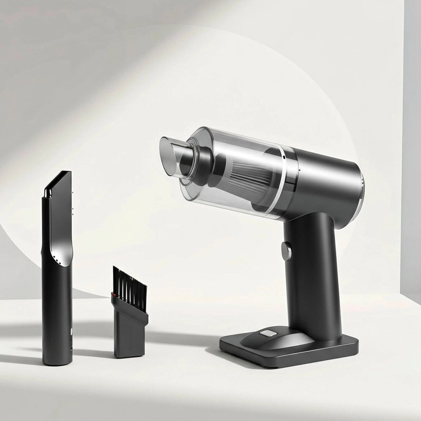 Silver handheld vacuum cleaner with attachments on a light gray background